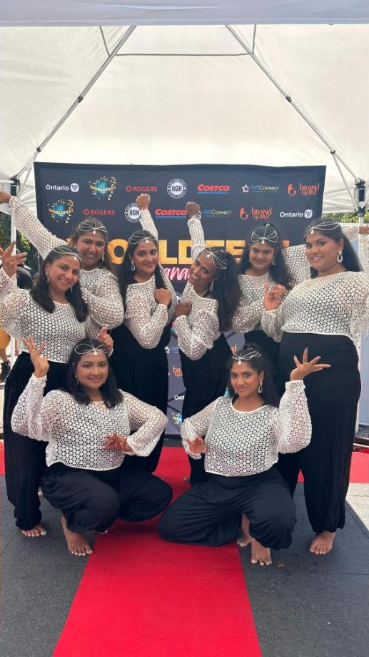 Masakali dancers in white and black costumes at WorldFest Canada